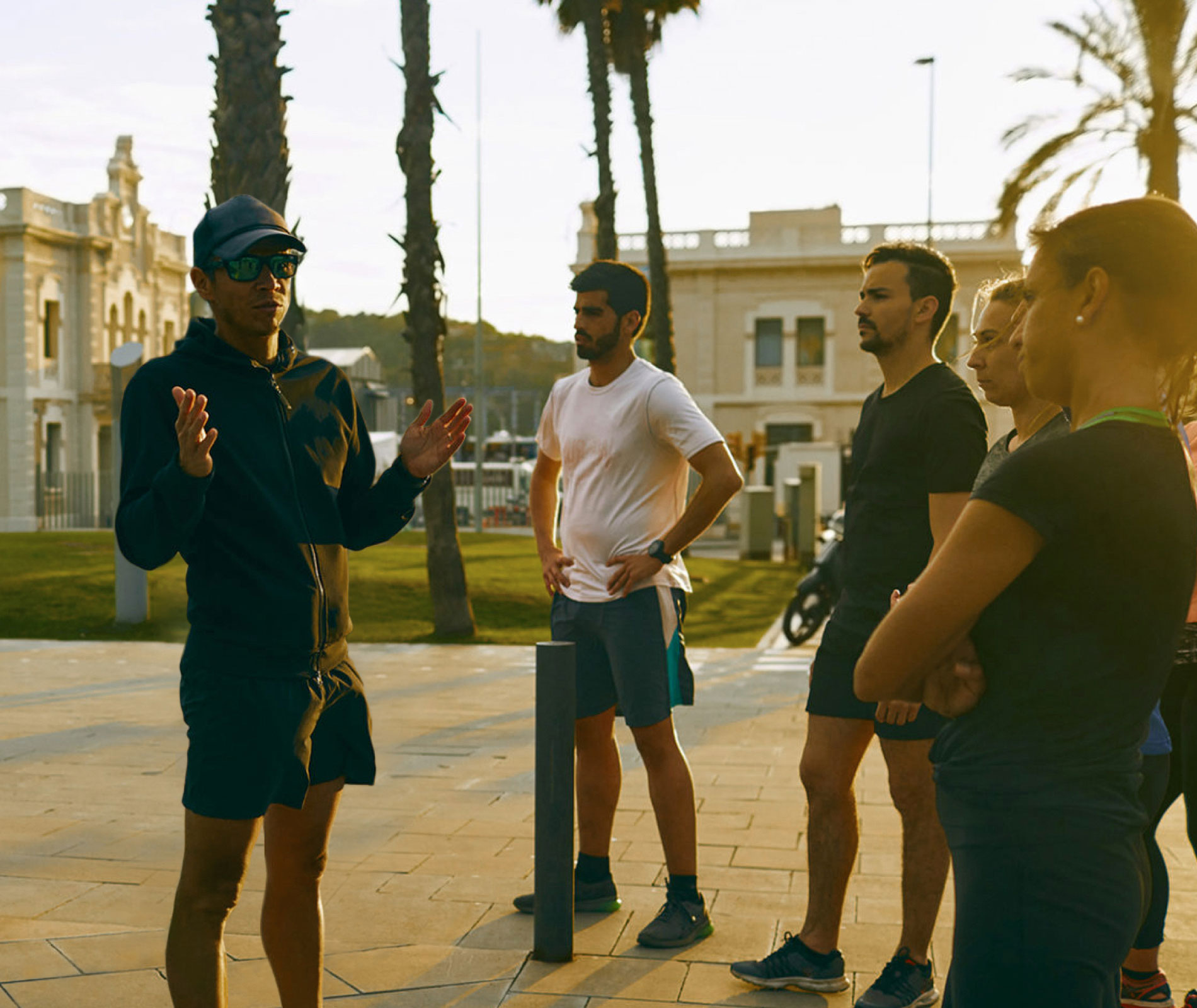 Coach instructing his athletes before a workout